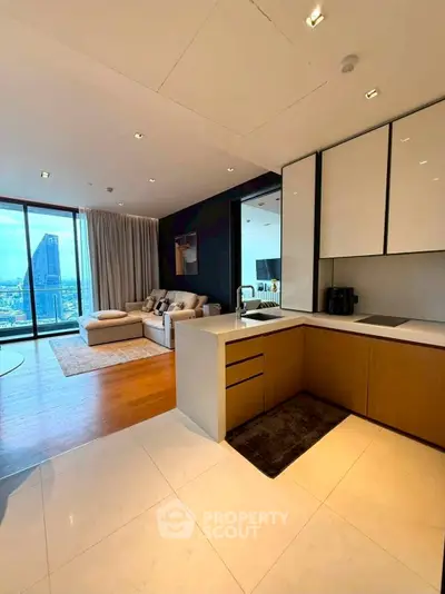 Luxurious open-plan living room with stunning city view and modern kitchen.