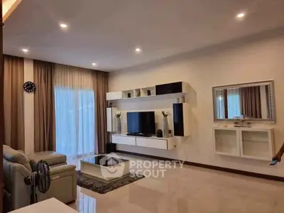 Spacious modern living room with elegant decor and natural lighting