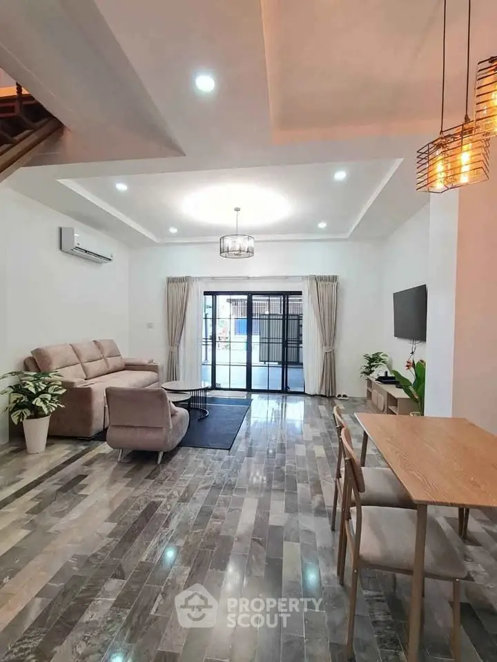 Spacious modern living room with elegant decor and natural light