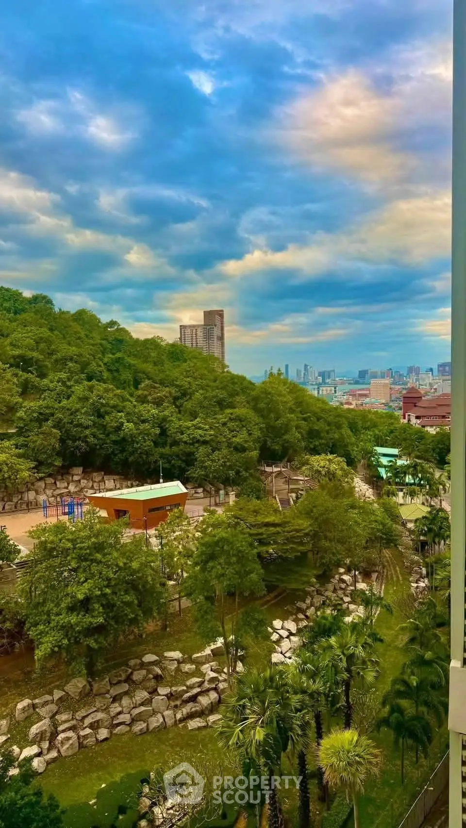 Stunning cityscape view from a lush green park with vibrant sky
