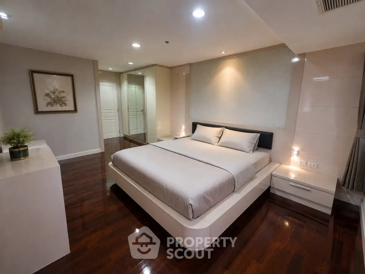 Luxurious modern bedroom with elegant decor and polished wooden floors