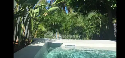 Luxurious private pool surrounded by lush greenery, perfect for relaxation and tranquility.