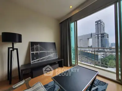 Modern living room with large window offering stunning city view and stylish decor