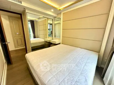 Luxurious bedroom with elegant design and mirrored wardrobe in modern apartment