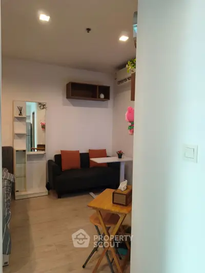 Cozy living room with modern decor and wooden flooring, perfect for relaxation and entertaining guests.