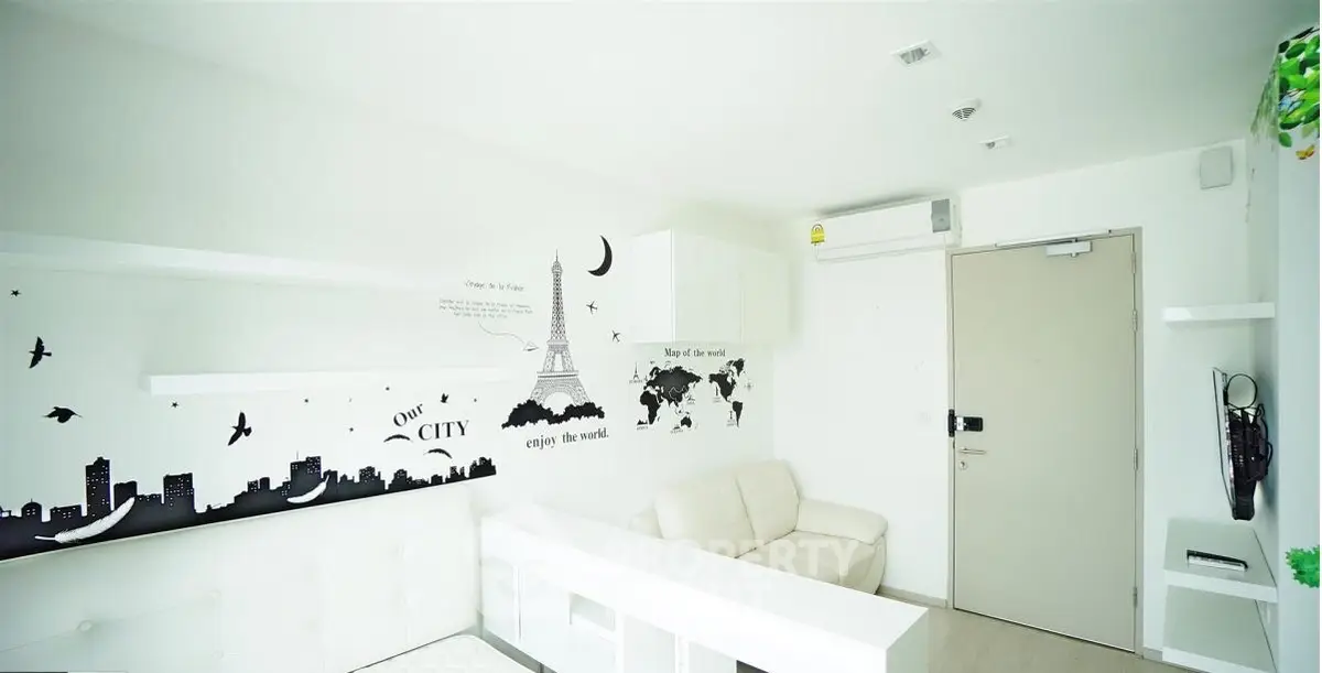 Modern living room with stylish wall art and cozy white sofa