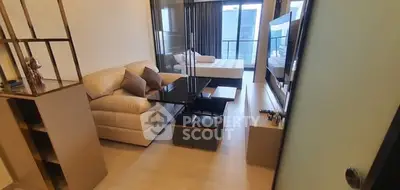 Modern studio apartment with cozy living area and stylish decor