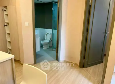 Modern apartment interior with bathroom and wooden flooring