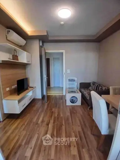 Cozy living room with modern decor and wooden flooring