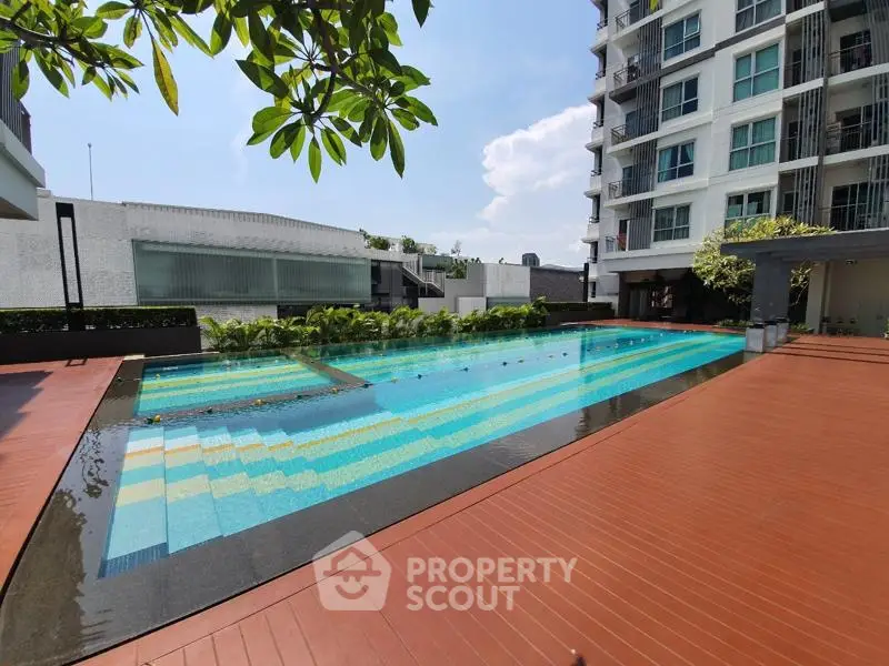 Luxurious condominium with stunning outdoor pool and modern architecture.