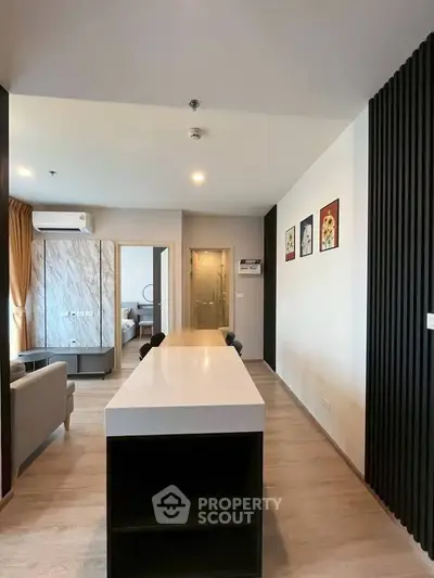 Modern open-plan living room with sleek design and stylish decor