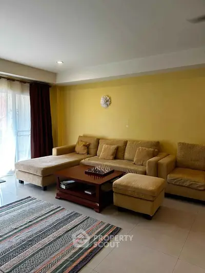 Spacious living room with cozy sectional sofa and natural light