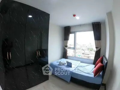 Modern bedroom with sleek black wardrobe and city view window