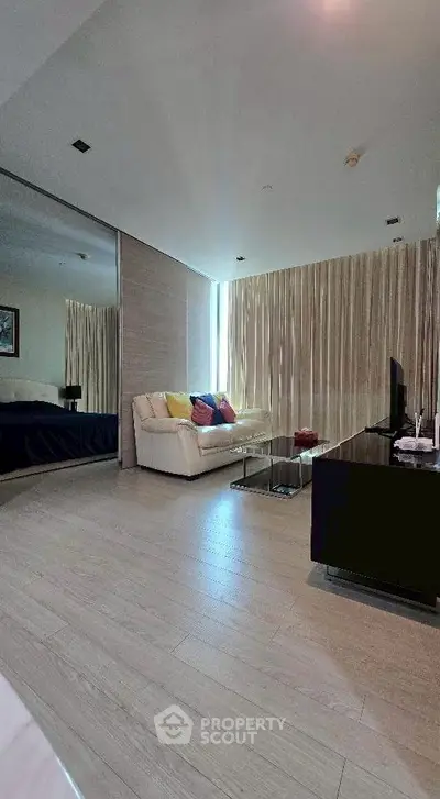 Modern living room with sleek design and cozy seating area