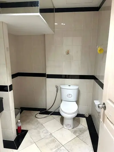 Modern bathroom with sleek tile design and contemporary fixtures.