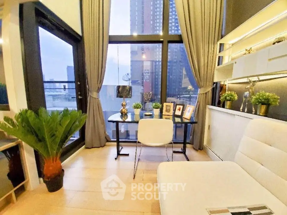 Modern study room with large windows and city view, featuring elegant decor and natural light.