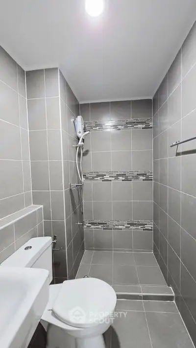 Modern bathroom with sleek gray tiles and contemporary fixtures