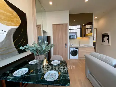 Modern open-plan living area with stylish kitchen and dining setup