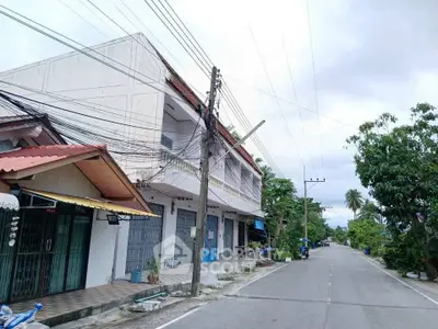 Charming residential street with spacious homes and lush greenery, perfect for serene living.