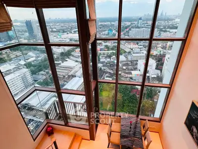 Stunning high-rise apartment with panoramic city views and elegant dining area.