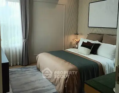 Cozy bedroom with elegant decor and large window for natural light