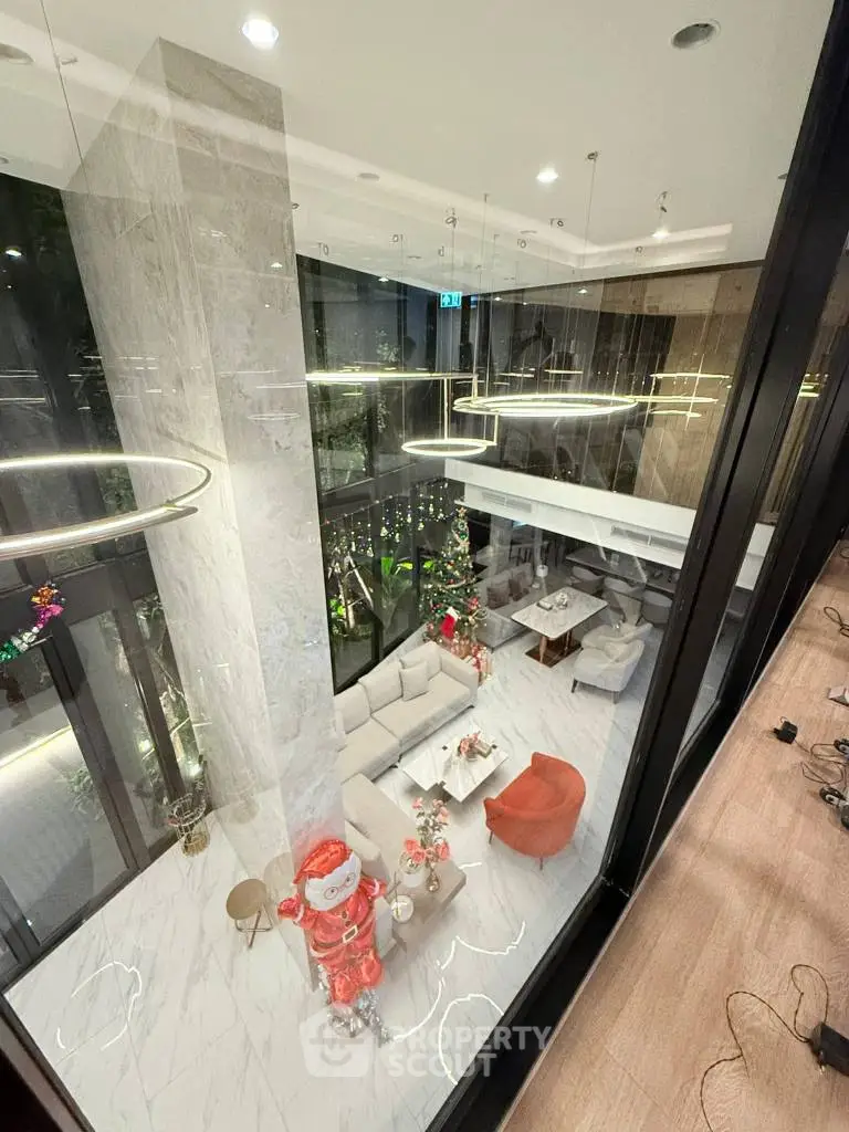 Luxurious modern living room with high ceilings and festive decor