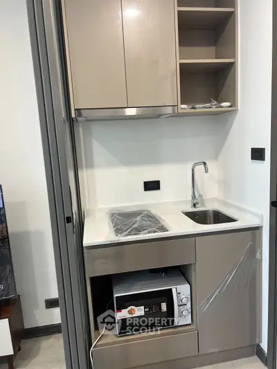 Modern kitchen with sleek appliances and stylish cabinetry