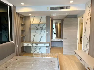 Modern bedroom with stylish wood paneling and built-in storage solutions