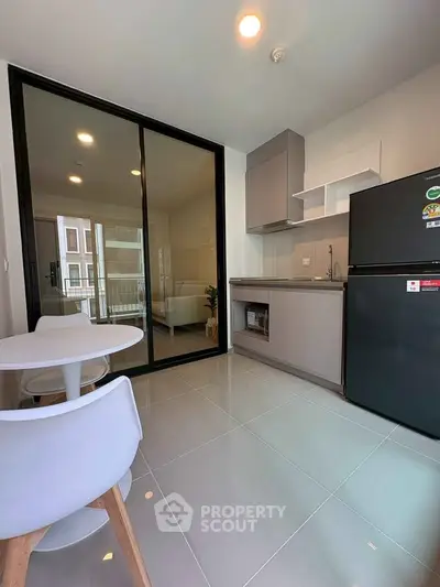 Modern kitchen with sleek design, featuring open layout and contemporary appliances, perfect for urban living.