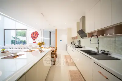 Luxurious modern kitchen with sleek design and open layout, perfect for entertaining.