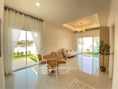 Spacious modern living room with elegant decor and garden view