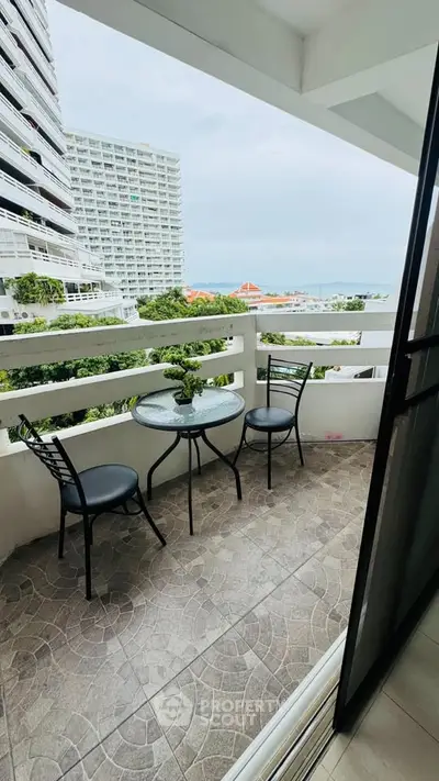 Charming balcony with ocean view, perfect for relaxing and enjoying the scenery.