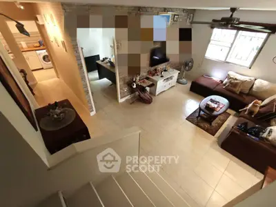 Spacious living room with modern decor and open layout, perfect for family gatherings.