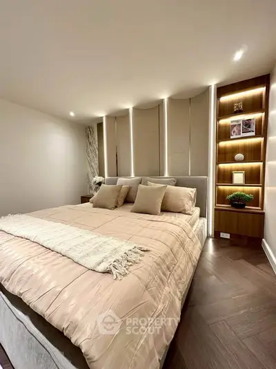 Luxurious bedroom with elegant lighting and plush bedding