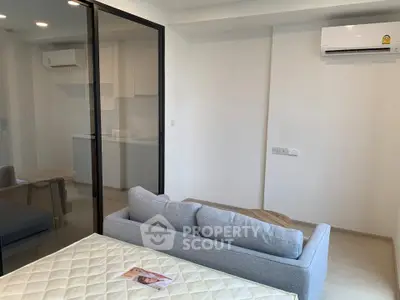 Modern studio apartment with glass partition and air conditioning