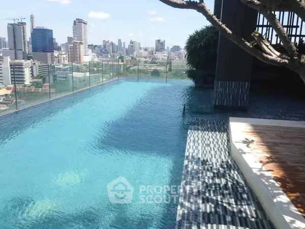 Stunning rooftop pool with panoramic city skyline views, perfect for luxury urban living.