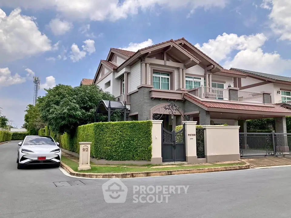 Stunning two-story house with modern design and lush greenery in a serene neighborhood.