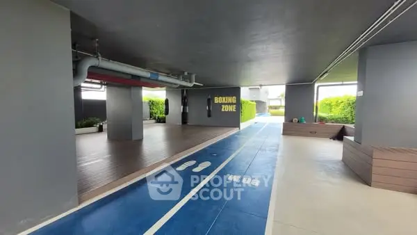 Modern apartment building with unique boxing zone and running track