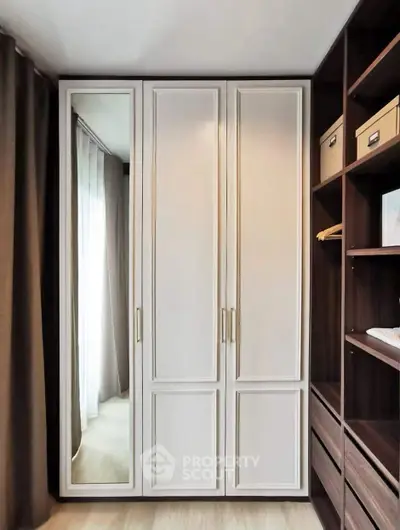 Elegant bedroom wardrobe with mirror and ample storage space