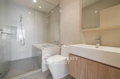 Modern bathroom with glass shower and sleek fixtures