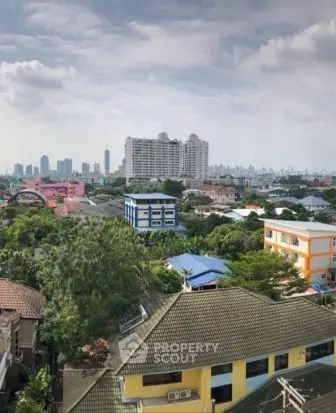 Stunning cityscape view with diverse architecture and lush greenery, perfect for urban living enthusiasts.