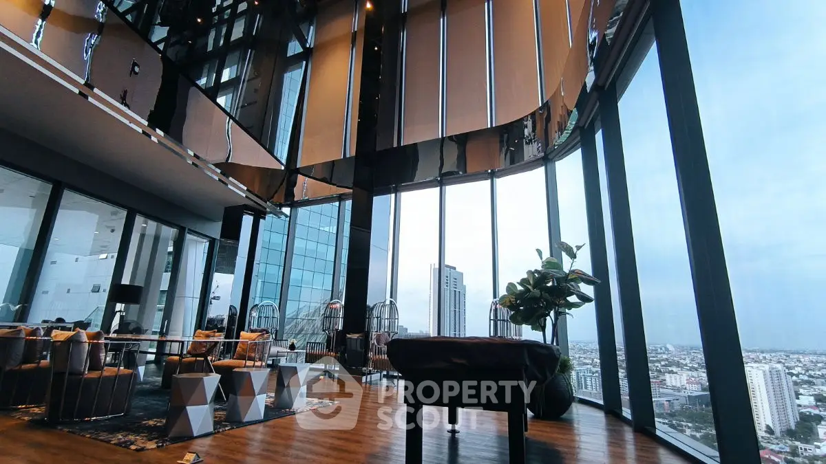 Luxurious high-rise living room with panoramic city views and modern decor