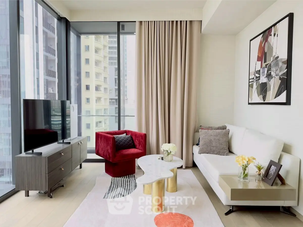 Modern living room with floor-to-ceiling windows and stylish decor in a high-rise apartment.