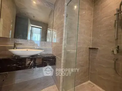 Modern bathroom with sleek design and glass shower enclosure