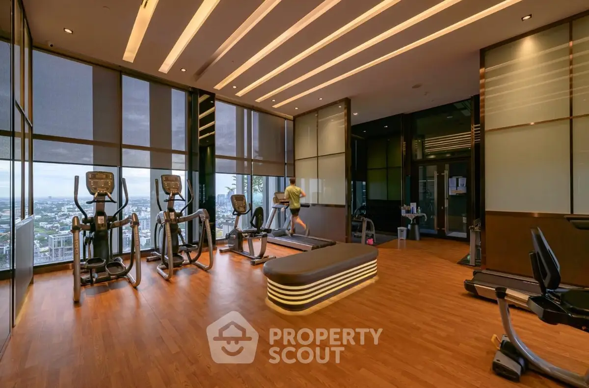 Luxury high-rise gym with city view and modern equipment