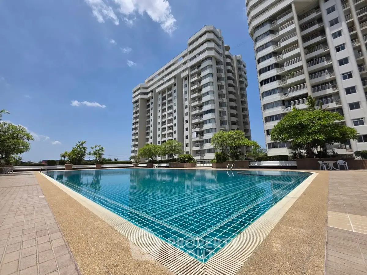 Luxurious high-rise apartment with stunning pool and modern architecture