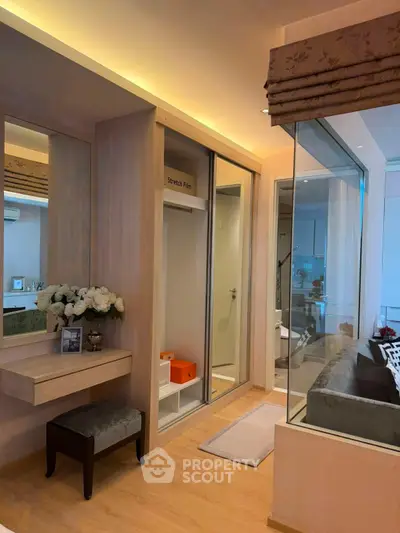 Modern bedroom with glass partition and elegant decor