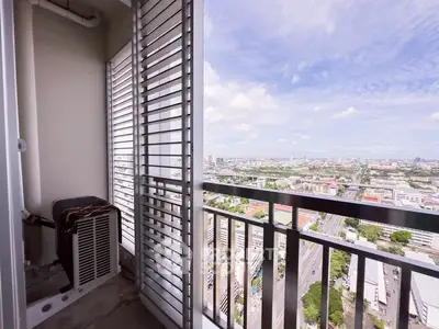 Stunning high-rise balcony with panoramic city view, perfect for urban living.