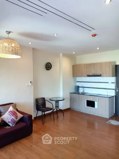 Modern living room with open kitchen and stylish decor