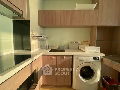 Modern kitchen with integrated washing machine and sleek cabinetry